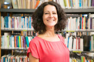 smiling caucasian woman posing public library 74855 1623